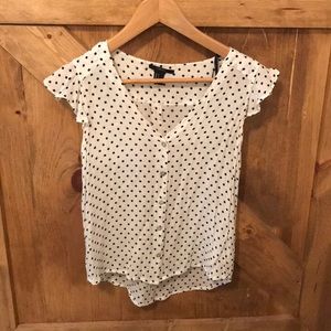 Polka-dotted blouse.